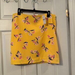 Ann Taylor yellow with pink floral design lined mini skirt size 12, NWT.